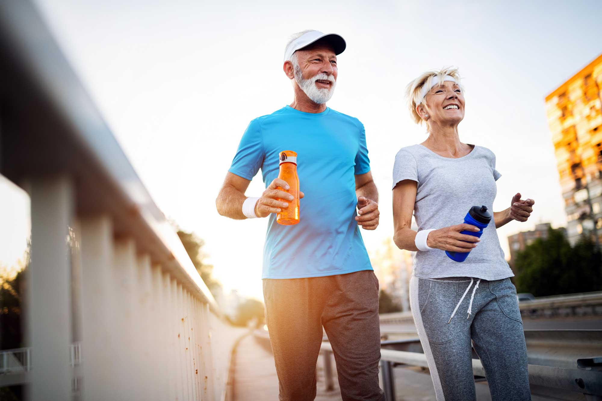 mature-couple-jogging-and-running-outdoors-in-city