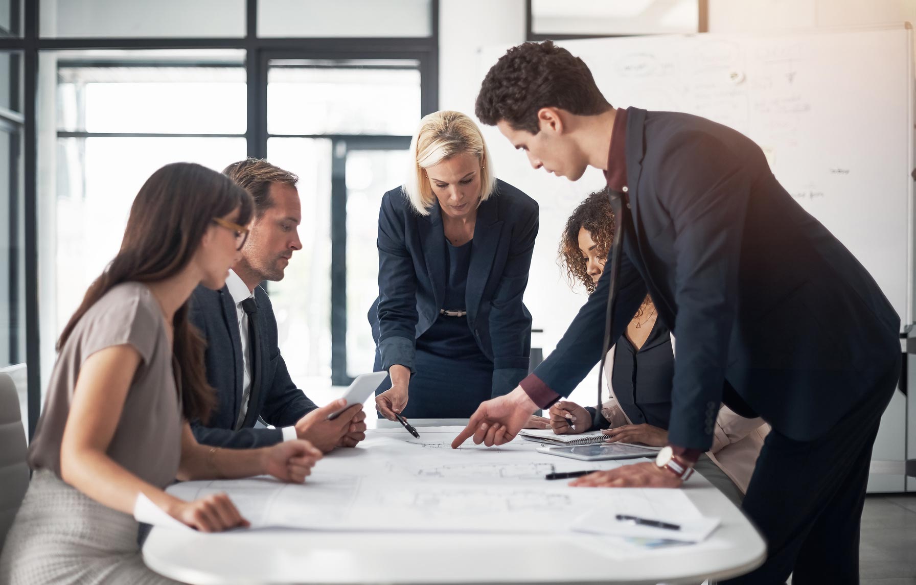 group of professionals in a huddle